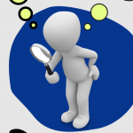 Figur mit Lupe in der Hand
